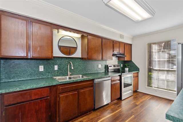 kitchen with dark hardwood / wood-style flooring, tasteful backsplash, ornamental molding, stainless steel appliances, and sink