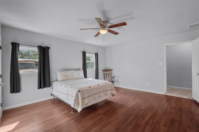 bedroom featuring hardwood / wood-style flooring and ceiling fan