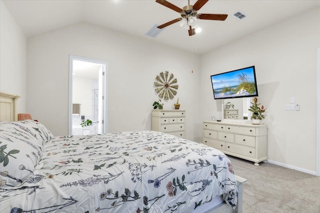 carpeted bedroom featuring ceiling fan, lofted ceiling, and ensuite bathroom