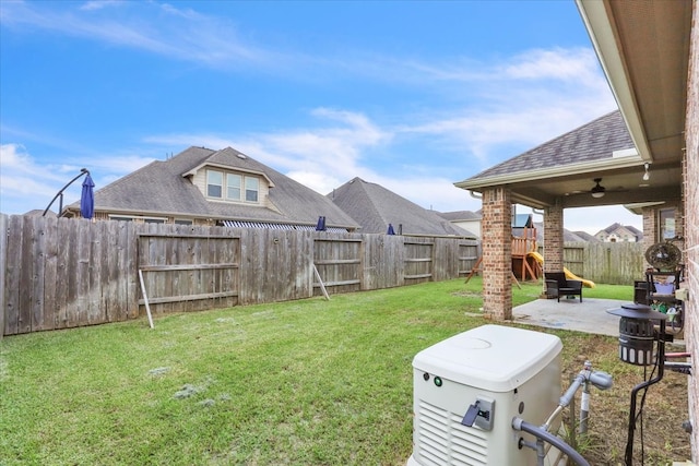 view of yard featuring a playground, a patio area, and ceiling fan