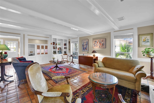 tiled living room featuring beamed ceiling, built in shelves, and crown molding