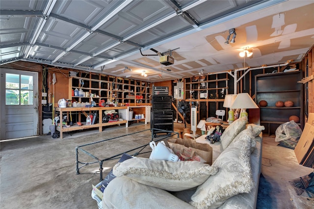 garage featuring french doors, a garage door opener, and ceiling fan