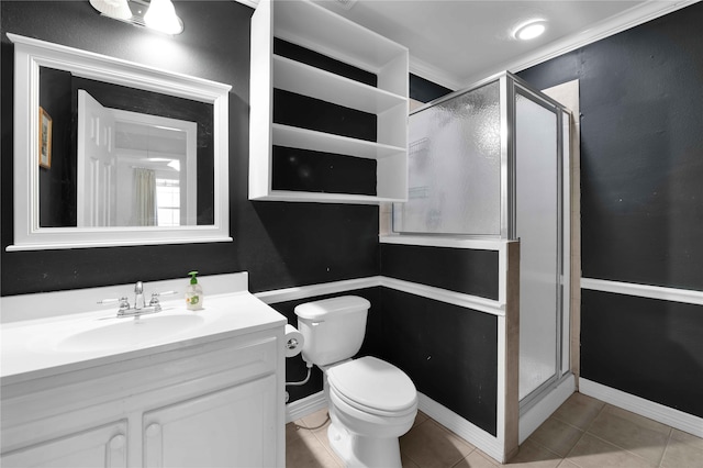 bathroom featuring tile patterned floors, vanity, toilet, and walk in shower