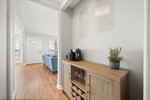 interior space with light wood-style floors and baseboards
