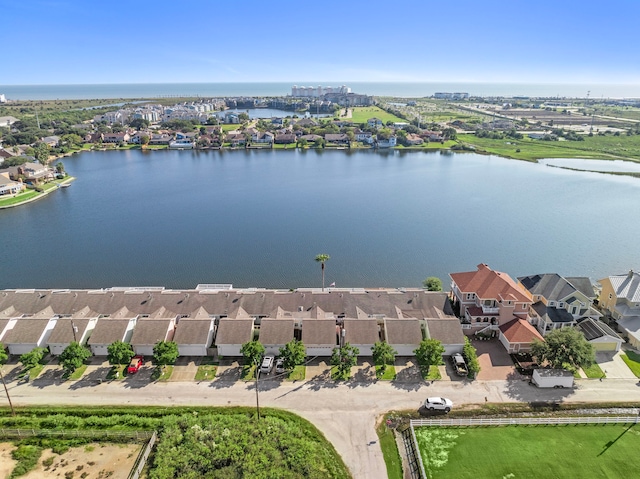 drone / aerial view with a water view and a residential view