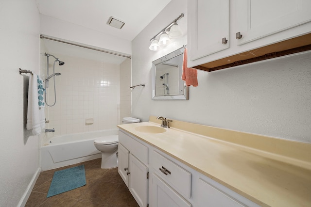 bathroom with vanity, baseboards, tile patterned flooring,  shower combination, and toilet