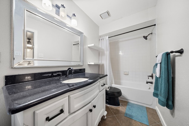 bathroom featuring vanity, visible vents, toilet, shower / tub combo, and tile patterned floors