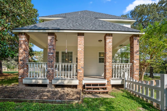 rear view of house with a porch