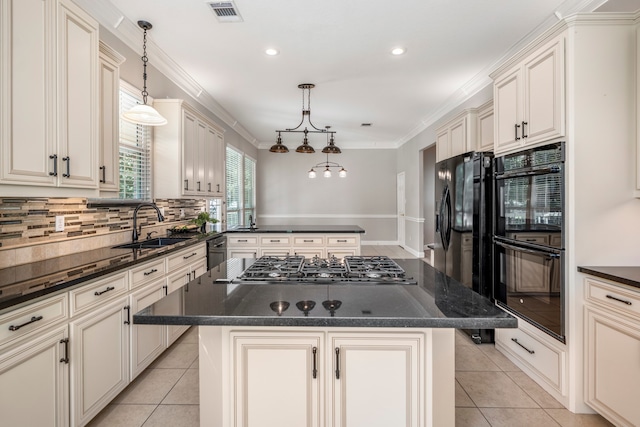 kitchen featuring black appliances, a center island, pendant lighting, and sink