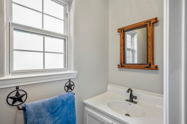 bathroom with plenty of natural light and vanity