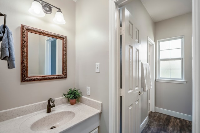 bathroom featuring wood-type flooring and vanity