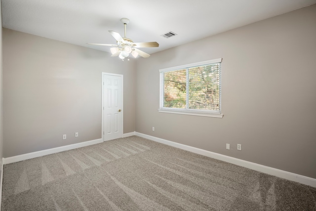 carpeted empty room with ceiling fan