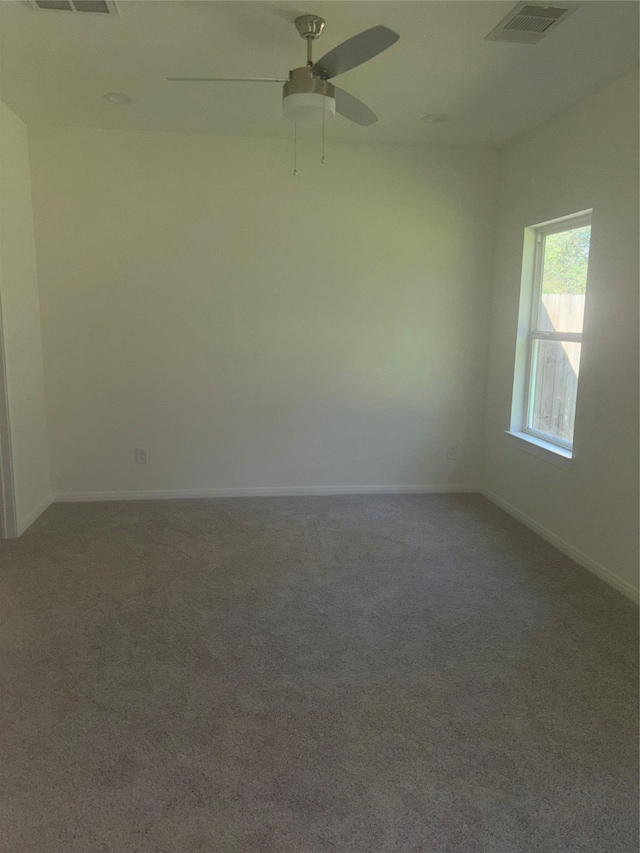 empty room with carpet floors and ceiling fan