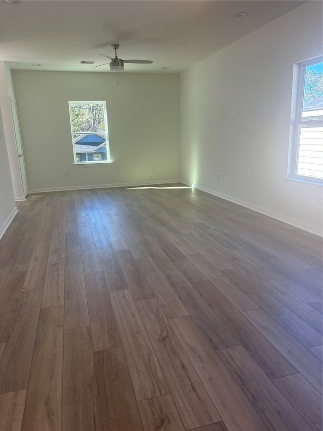 spare room featuring ceiling fan and light wood-type flooring