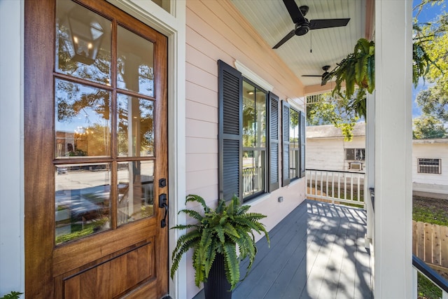 deck featuring ceiling fan and a porch