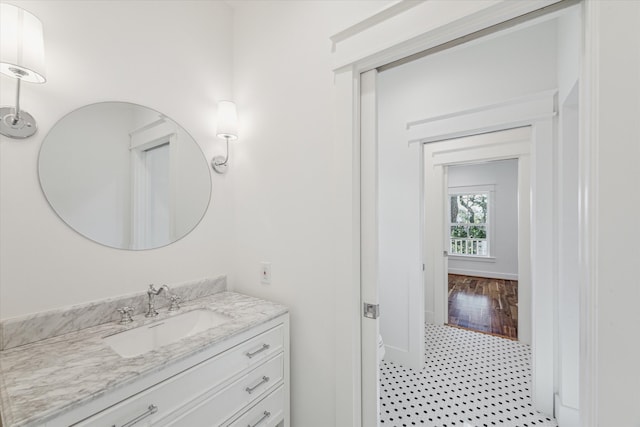 bathroom featuring hardwood / wood-style flooring and vanity