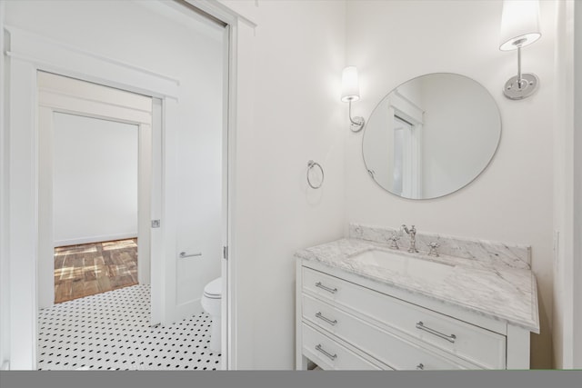 bathroom featuring vanity and toilet