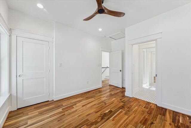 unfurnished bedroom with ceiling fan, a closet, and light hardwood / wood-style floors