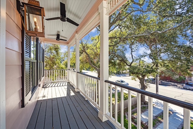 wooden deck featuring ceiling fan and a porch