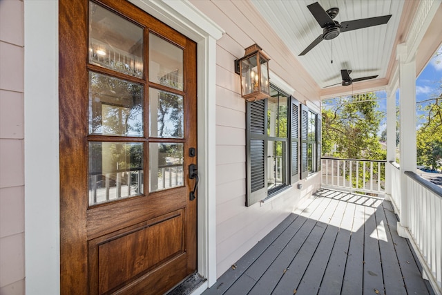 wooden deck with ceiling fan and a porch