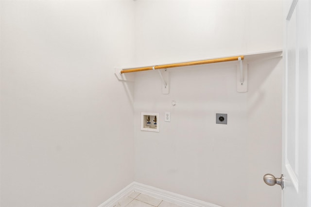 laundry area featuring hookup for a washing machine, electric dryer hookup, and light tile patterned flooring