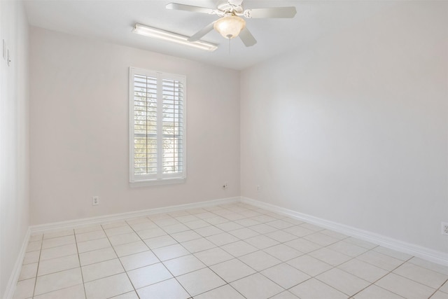 tiled empty room featuring ceiling fan