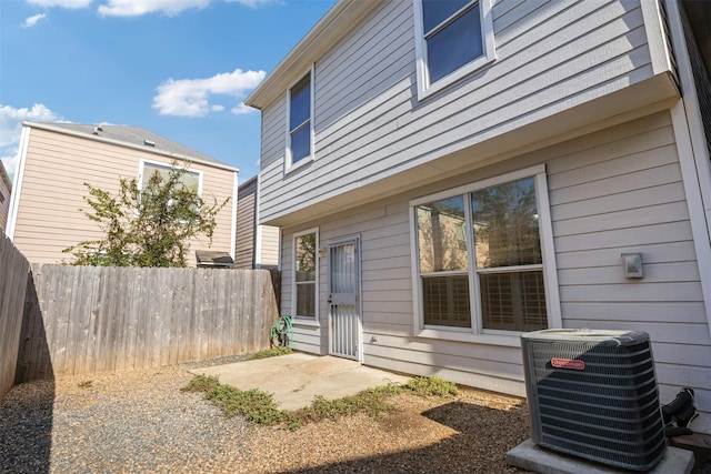 back of property with central air condition unit