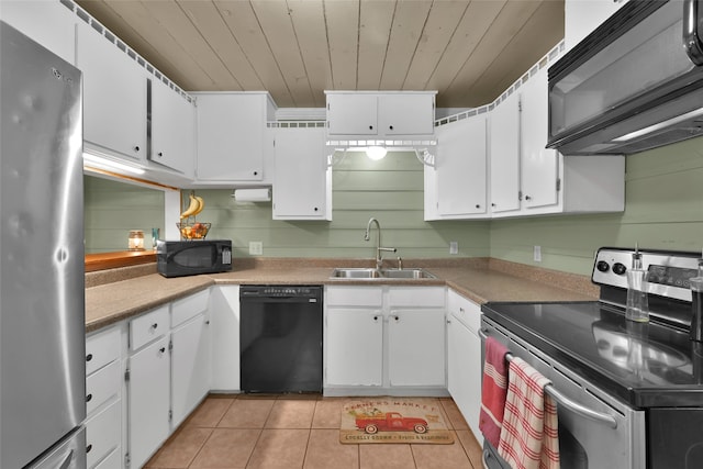 kitchen with sink, white cabinetry, and black appliances