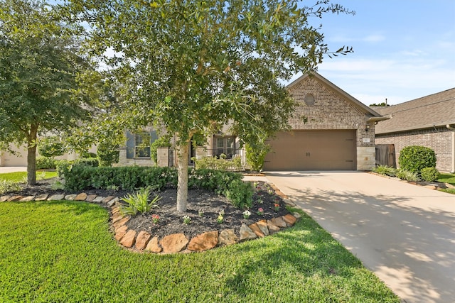 obstructed view of property with a front lawn and a garage