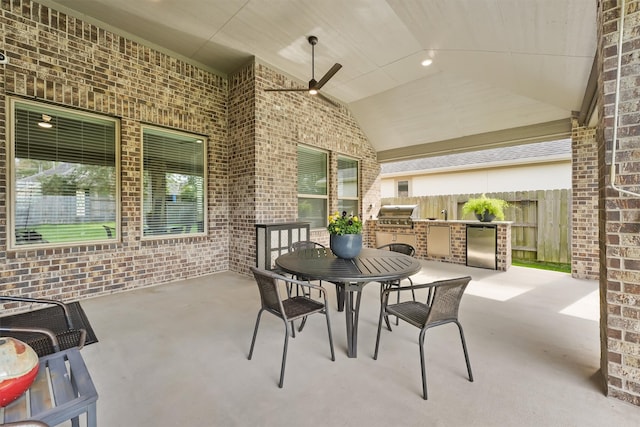 view of patio / terrace featuring a grill and an outdoor kitchen