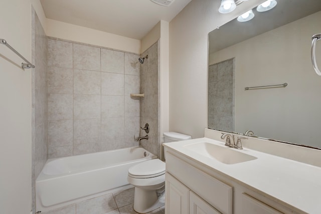 full bathroom featuring toilet, vanity, tile patterned floors, and tiled shower / bath