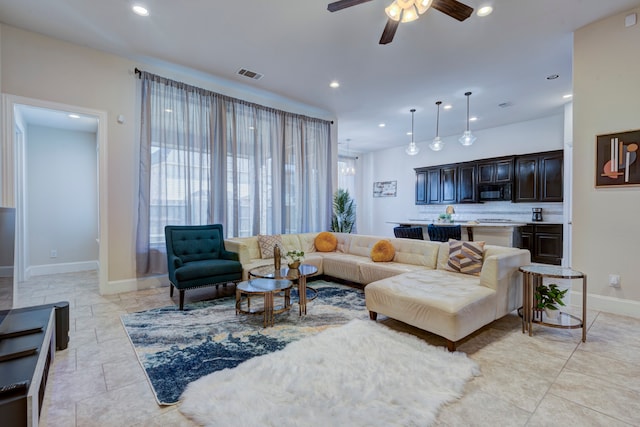 living room featuring ceiling fan