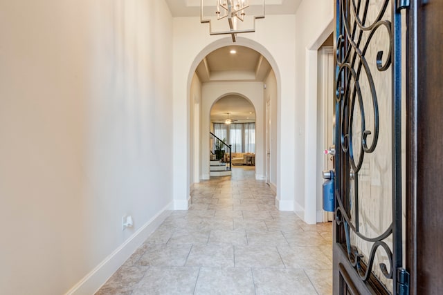 entryway with a notable chandelier