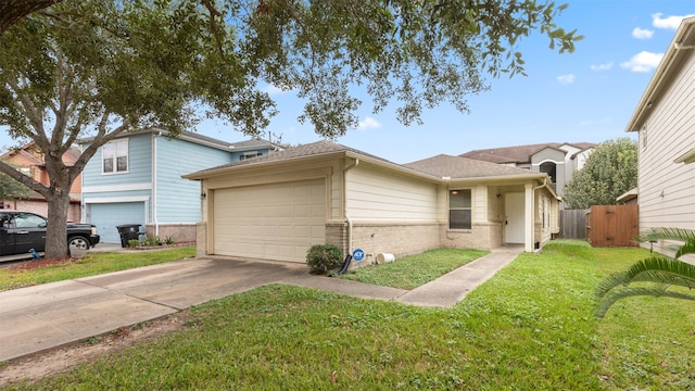 view of front of house with a garage and a front lawn