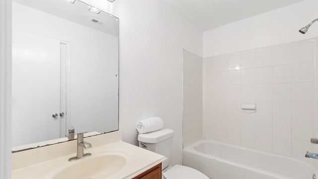 full bathroom featuring vanity, toilet, and tiled shower / bath combo