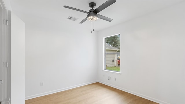 spare room with light hardwood / wood-style floors and ceiling fan