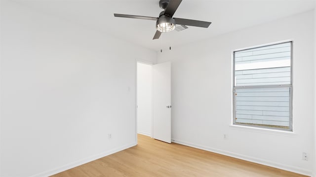 empty room featuring ceiling fan and light wood-type flooring