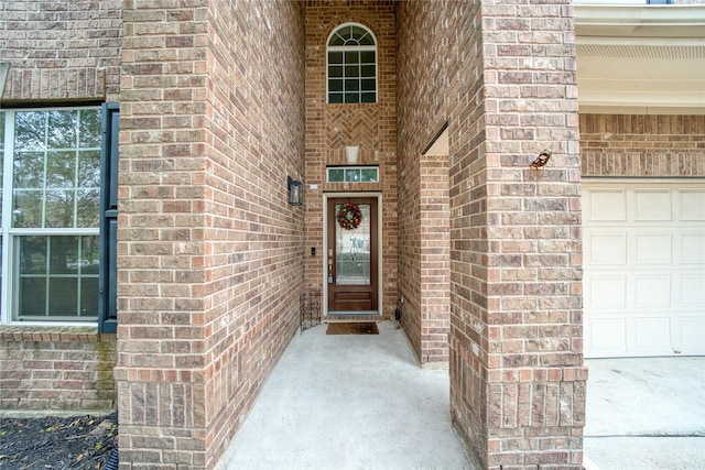 entrance to property featuring a garage