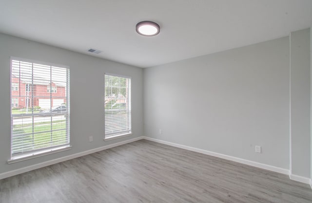 unfurnished room with light hardwood / wood-style flooring