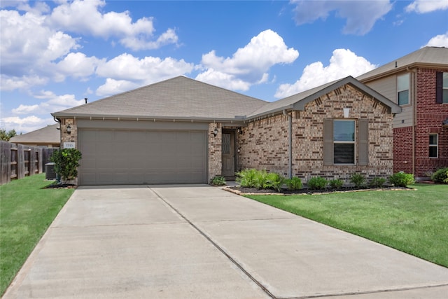 view of front of home featuring central AC, a front yard, and a garage