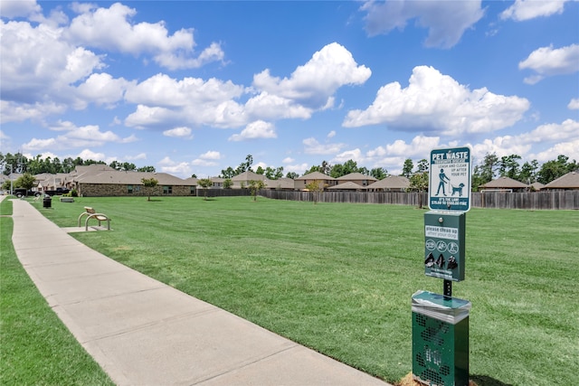 view of home's community with a lawn