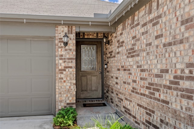 view of exterior entry featuring a garage