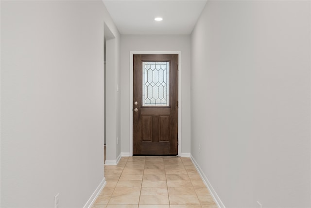 doorway featuring light tile patterned flooring