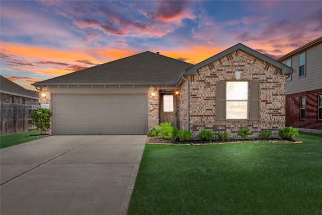 view of front facade featuring a yard and a garage