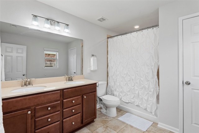 full bathroom featuring tile patterned floors, vanity, toilet, and shower / bath combo