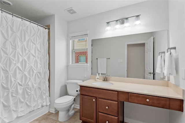 full bathroom featuring tile patterned floors, vanity, toilet, and shower / tub combo