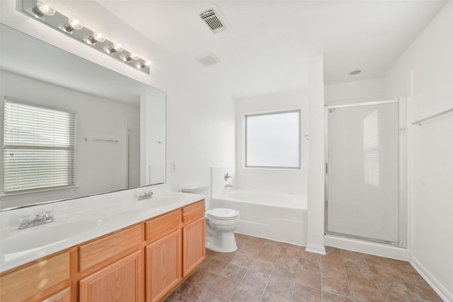 full bathroom featuring separate shower and tub, vanity, and toilet