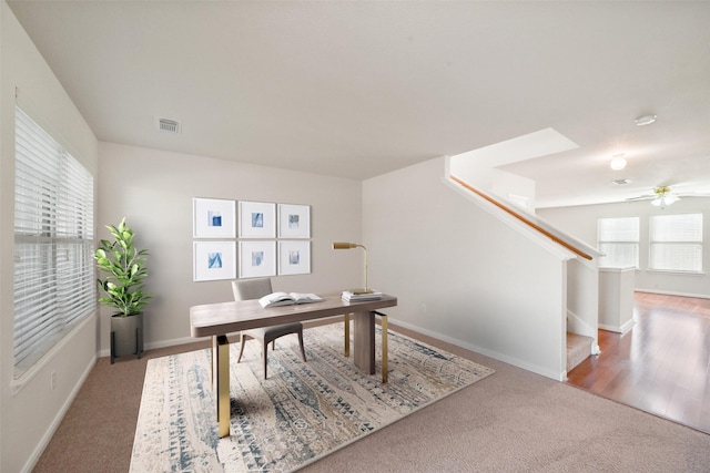 home office with ceiling fan and hardwood / wood-style floors