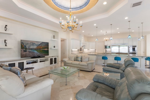 living room with a raised ceiling, ornamental molding, and an inviting chandelier