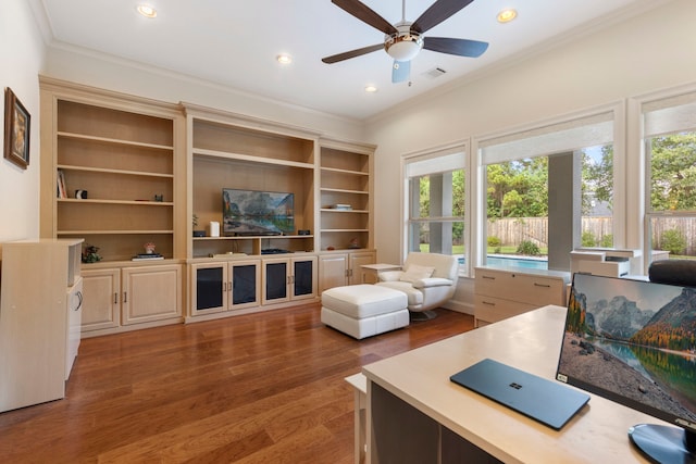 living room with ceiling fan, ornamental molding, a healthy amount of sunlight, and hardwood / wood-style flooring